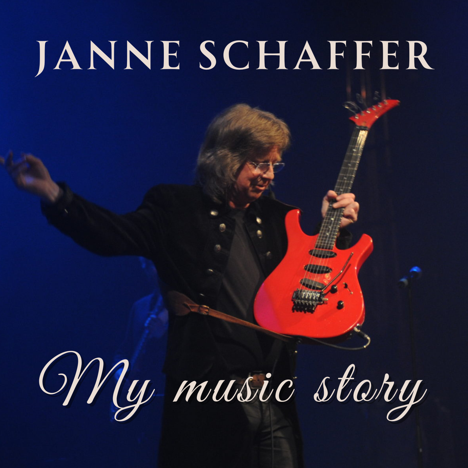 Janne schaffer står med sin röda gitarr på scenen.